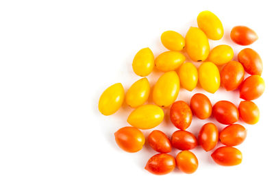 Close-up of oranges over white background