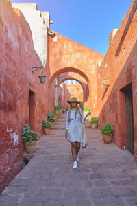 Rear view of woman walking on street