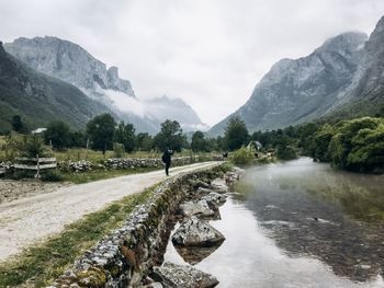 Scenic view of lake and mountains against sky