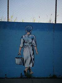Bicycle statue against wall