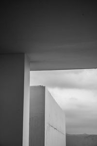 Low angle view of building against cloudy sky