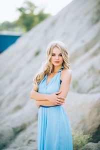 Portrait of a smiling young woman standing outdoors
