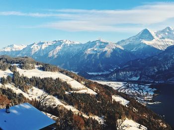 Scenic view of snowcapped mountains against sky