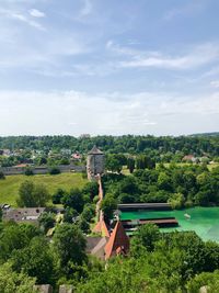 Scenic view of trees and buildings against sky