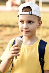 Portrait of boy holding ice cream