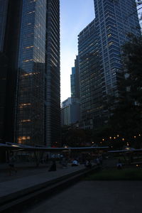 Modern buildings in city against sky