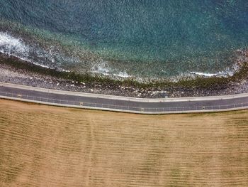 High angle view of trees by sea