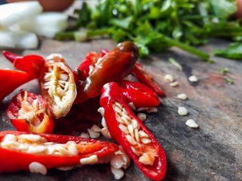 Chopped red chili peppers on table