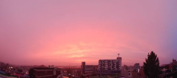 Buildings against sky during sunset