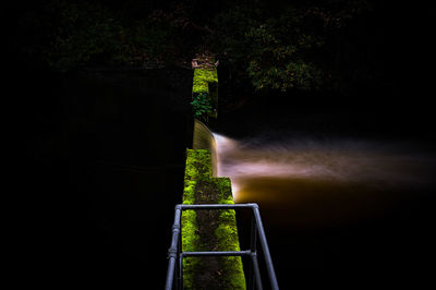 Scenic view of waterfall at night