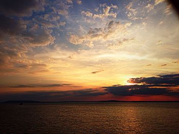 Scenic view of sea at sunset