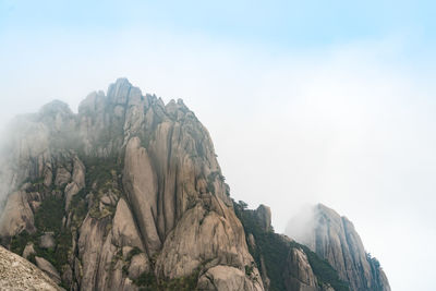 Scenic view of rocky mountains against sky