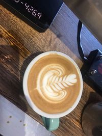 High angle view of cappuccino on table