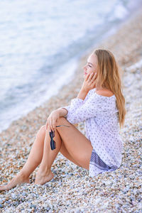 Woman sitting at beach