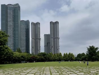 Modern buildings in city against sky