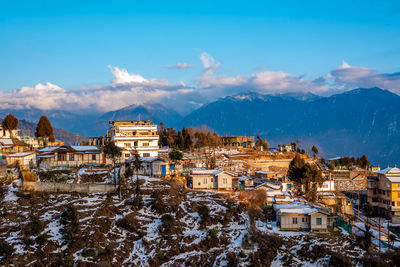 Townscape against sky during winter