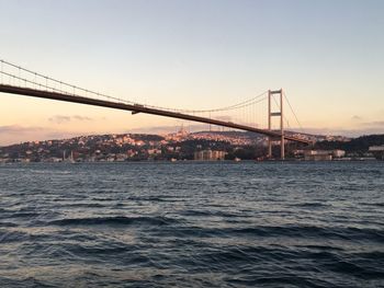 View of suspension bridge over river