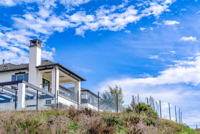 Low angle view of building against blue sky