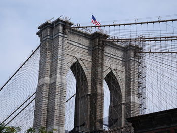 Flag over brooklyn bridge