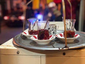 Close-up of turkish tea cups on tray in restaurant