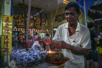 Man sitting in market