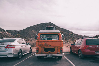 Cars on road against sky