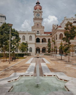 View of historic building against cloudy sky