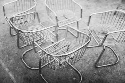 Close-up of chairs on table