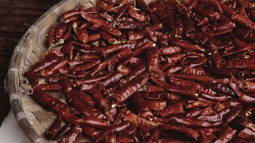 High angle view of red chili peppers in container