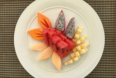 Directly above shot of fruits slice in plate on table