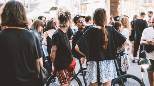 Rear view of people on city street