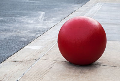Close-up of red ball on table