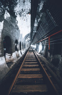 View of railroad tracks in tunnel