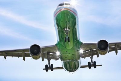 Low angle view of airplane against sky