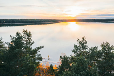 Scenic view of lake against sky during sunset