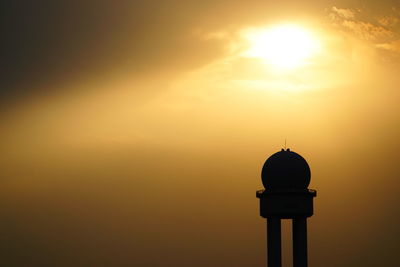 Silhouette of tower during sunset