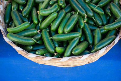 High angle view of green peas in basket