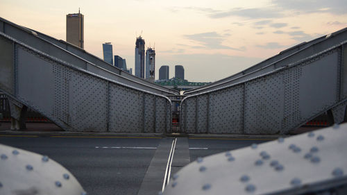 View of bridge and buildings against sky