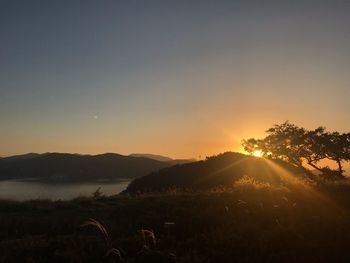 Scenic view of landscape against sky during sunset