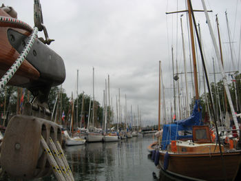 Boats moored at harbor