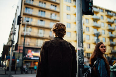 Rear view of woman looking at city