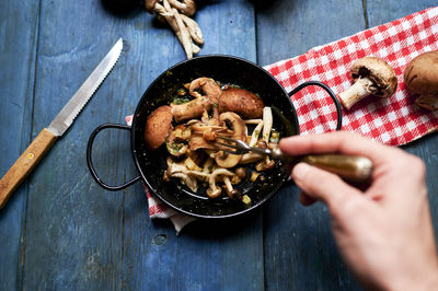 High angle view of person preparing food on table