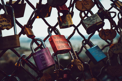 Close-up of padlocks with blurry paris view on the background 