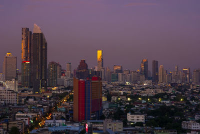 Aerial view of modern buildings in city against sky