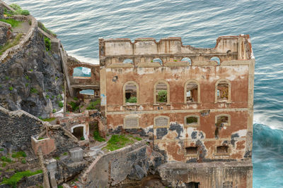 High angle view of old ruin at seaside