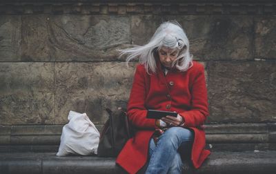 Full length of woman looking away