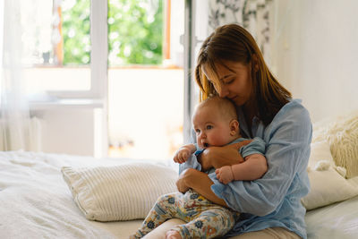 Portrait of a happy mother and child. a young mother is play with little baby boy