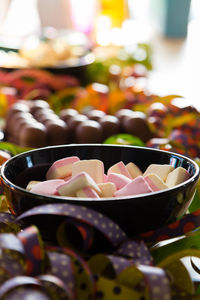 Close-up of candies in bowl on table