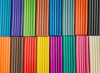 Rainbow colors of modeling clay. multicolored plasticine bars background.