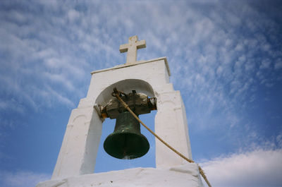Low angle view of bell tower against sky